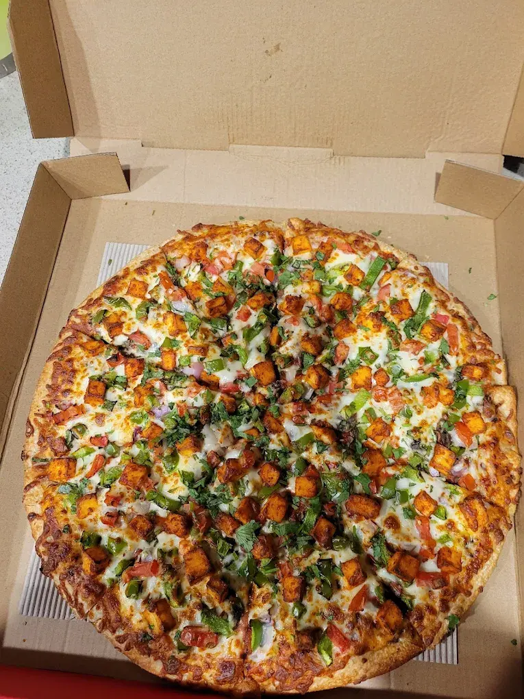 Butter chicken pizza at Pizza64 Edmonton